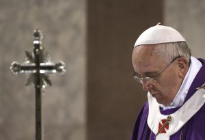 Pope Francis celebrates the Ash Wednesday mass at the Santa Sabina Basilica in Rome, Wednesday, March 5, 2014. Ash Wednesday marks the beginning of Lent, a solemn period of 40 days of prayer and self-denial leading up to Easter. (AP Photo/Max Rossi, Pool)